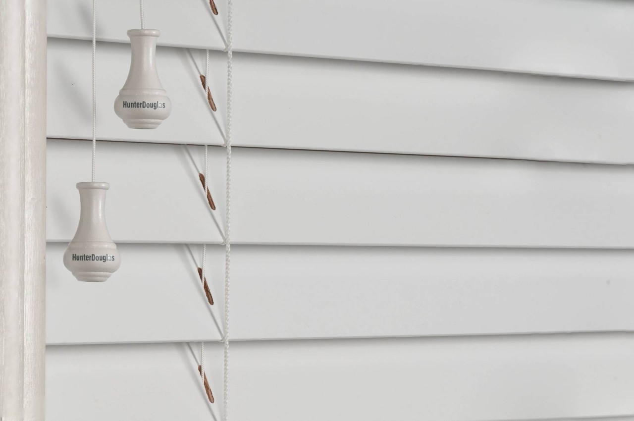  Close-up view of white Hunter Douglas blinds in a lanai near Kalaheo, HI